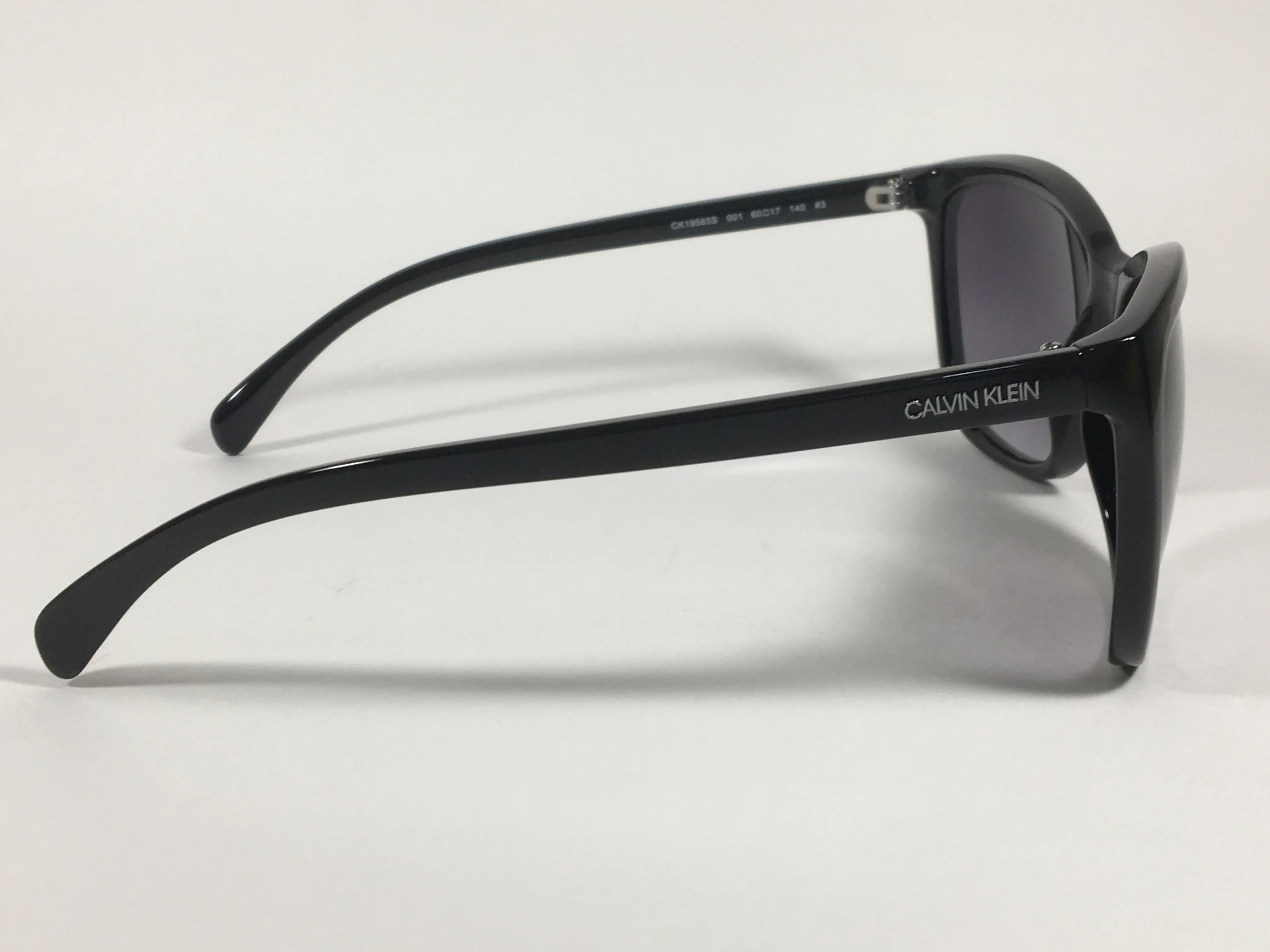 Calvin Klein Cat Eye Sunglasses CK19565S 001 Black Gloss Smoke Gradient Lens