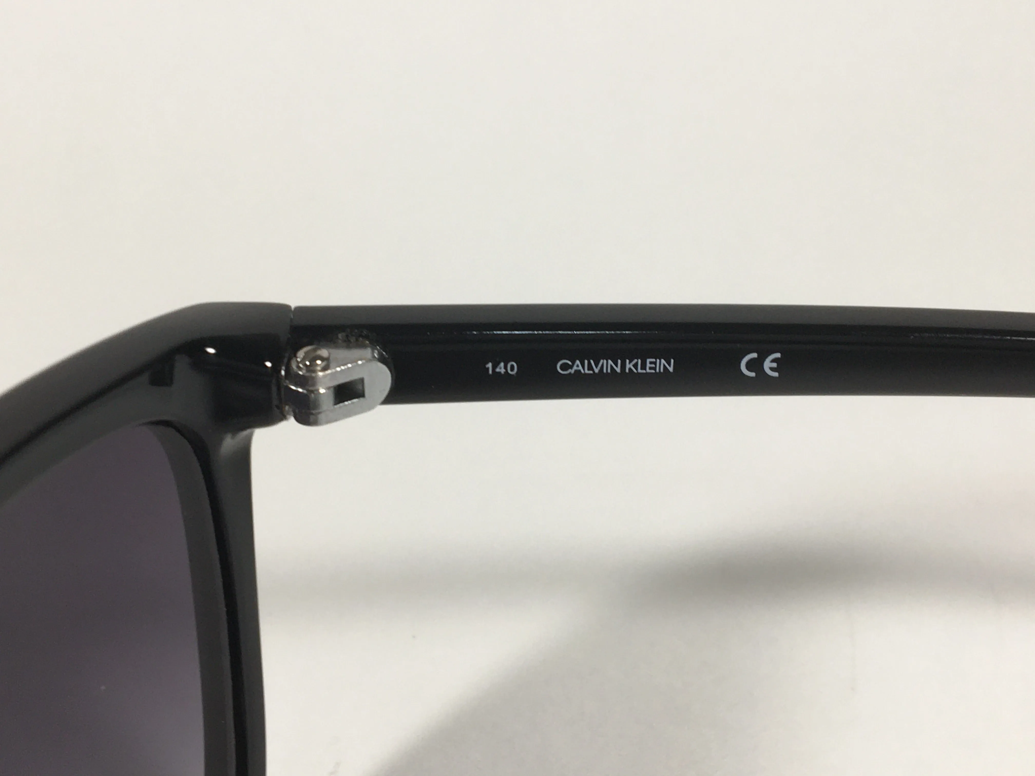 Calvin Klein Cat Eye Sunglasses CK19565S 001 Black Gloss Smoke Gradient Lens