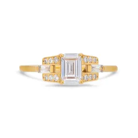 Emerald cut diamond buckle ring in yellow gold