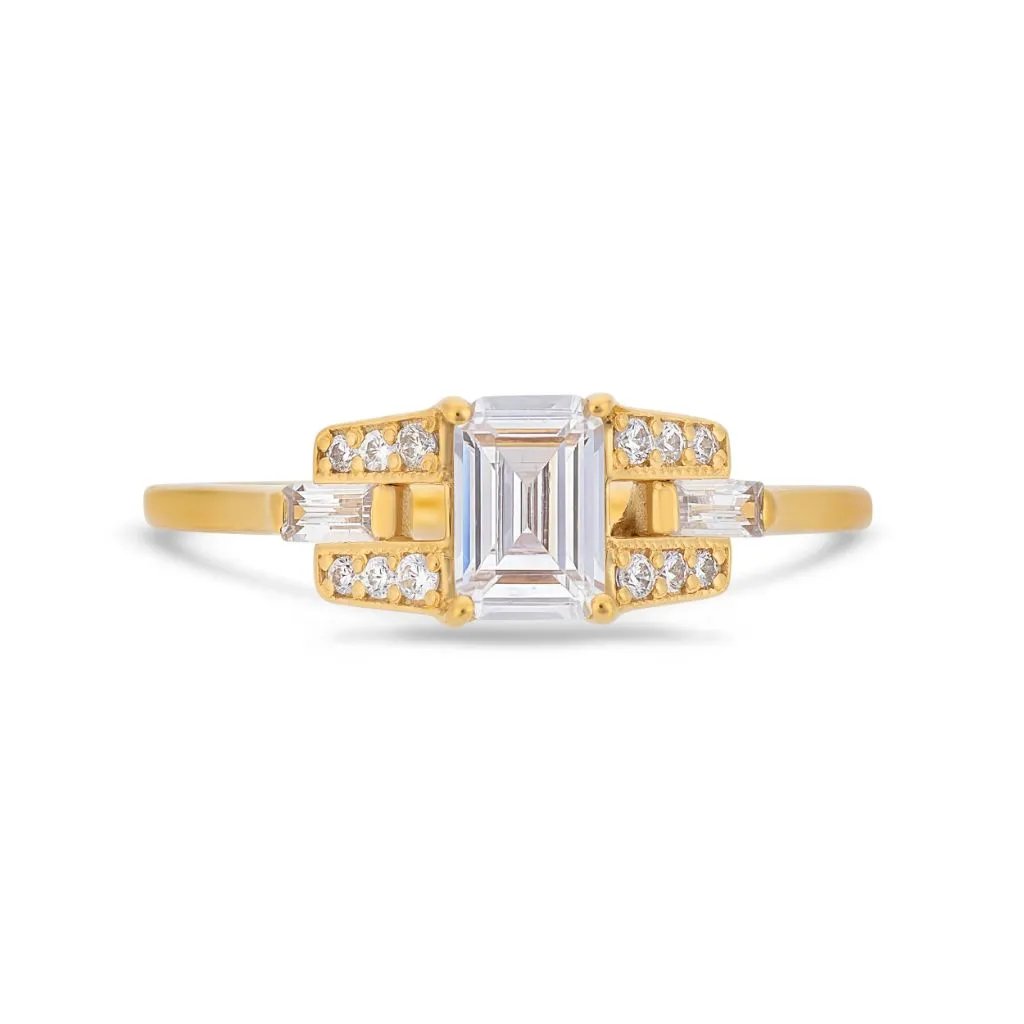Emerald cut diamond buckle ring in yellow gold