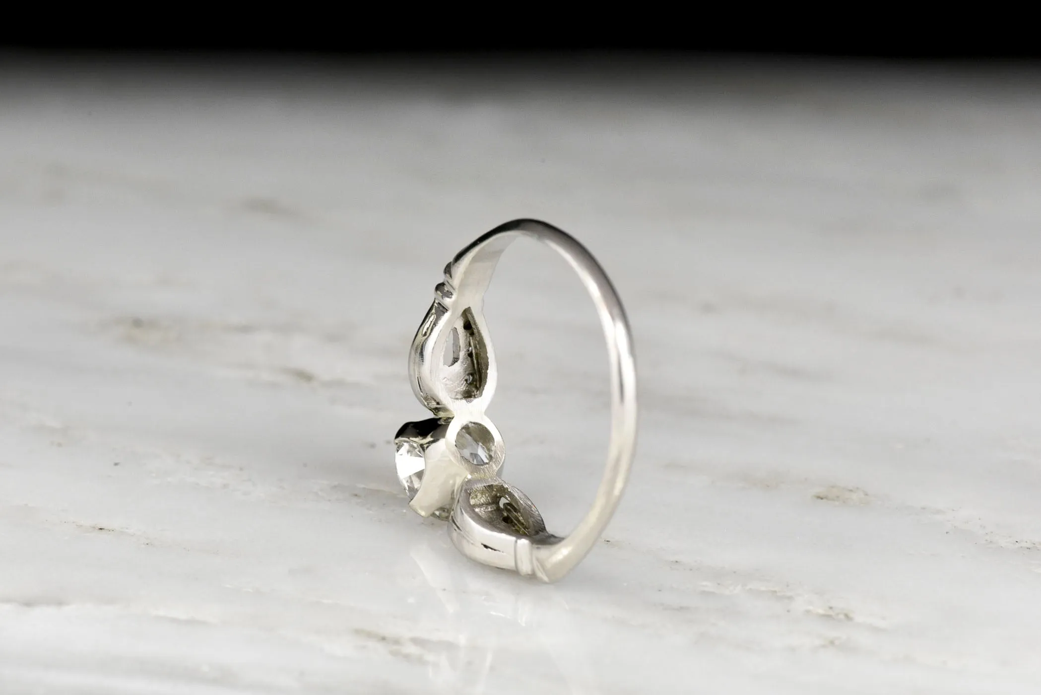 Late Art Deco/ Mid Century Platinum Engagement Ring with "Buckle-and-Clasp" Shoulders