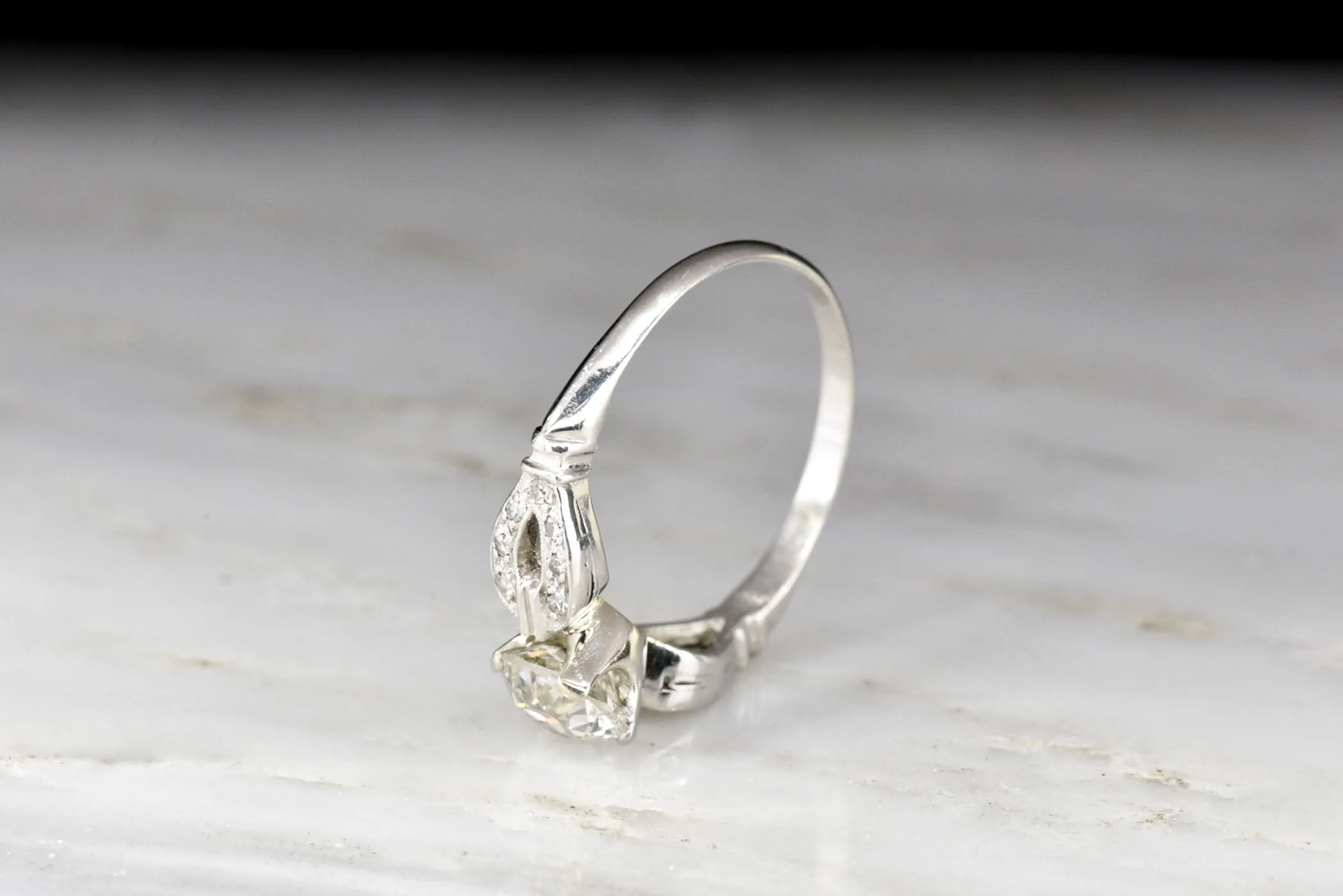 Late Art Deco/ Mid Century Platinum Engagement Ring with "Buckle-and-Clasp" Shoulders