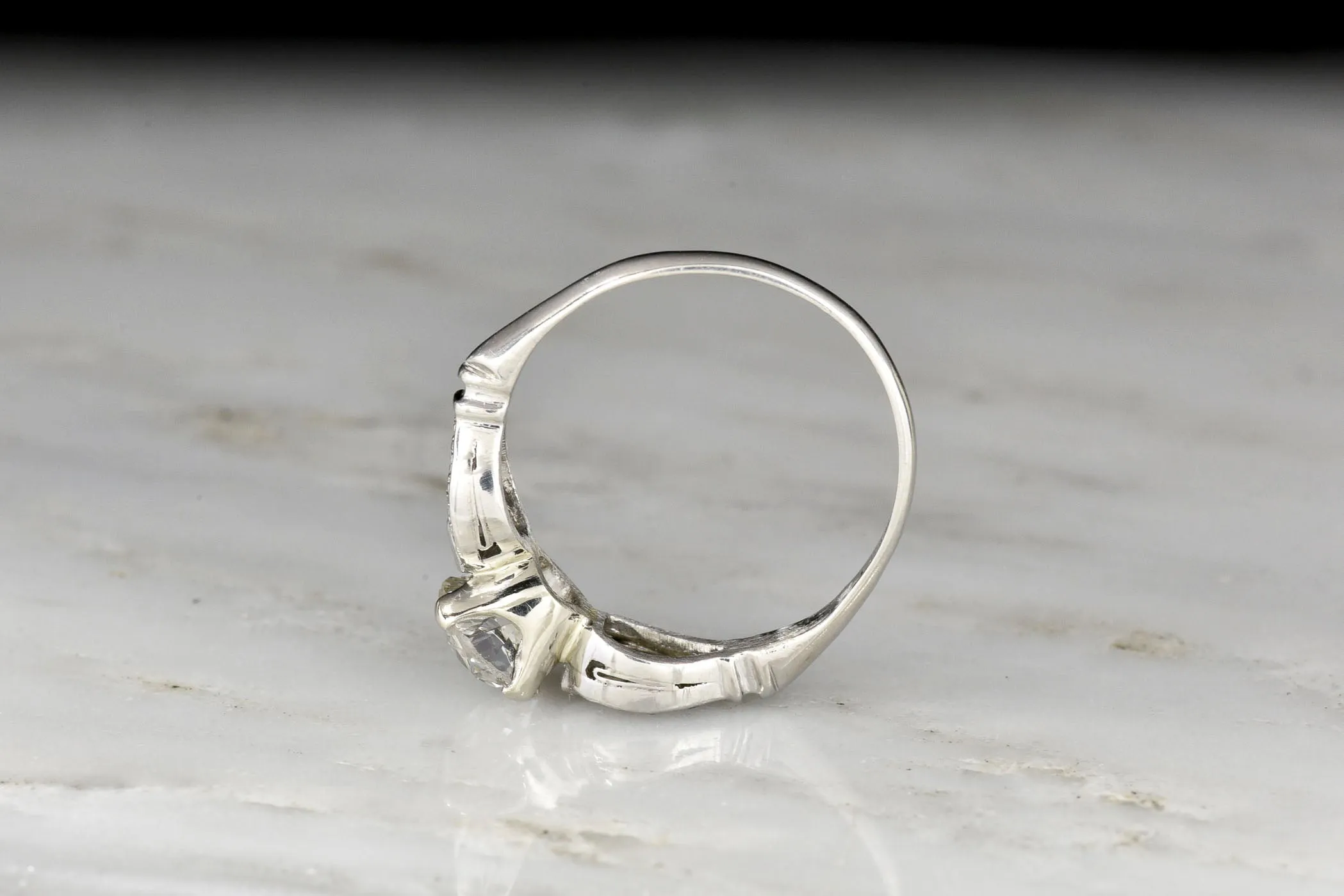 Late Art Deco/ Mid Century Platinum Engagement Ring with "Buckle-and-Clasp" Shoulders