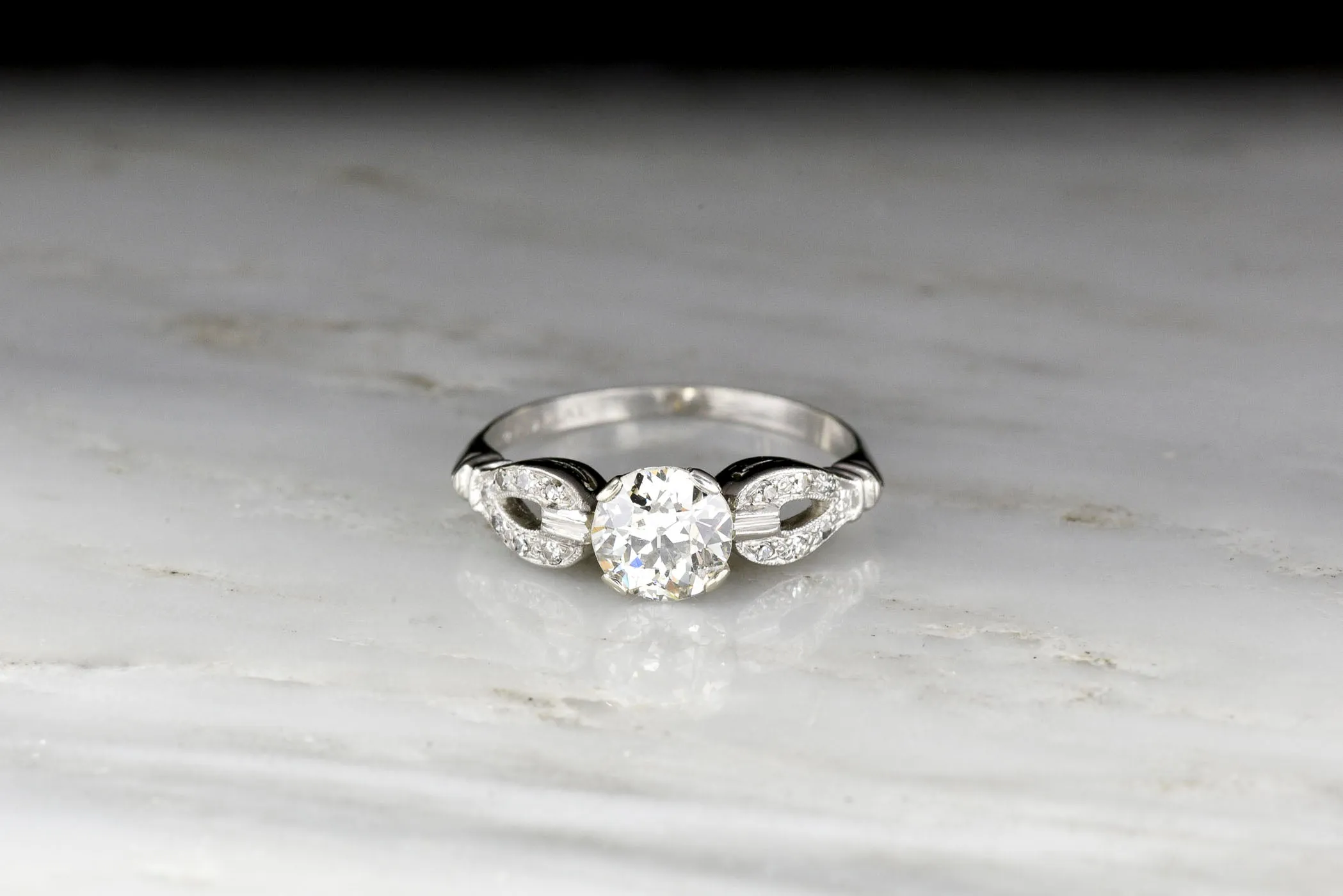 Late Art Deco/ Mid Century Platinum Engagement Ring with "Buckle-and-Clasp" Shoulders